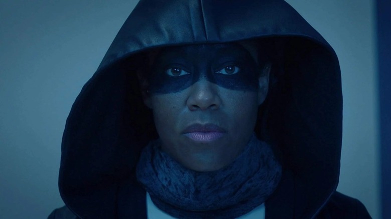 Angela Abar stares forward in her Sister Night costume