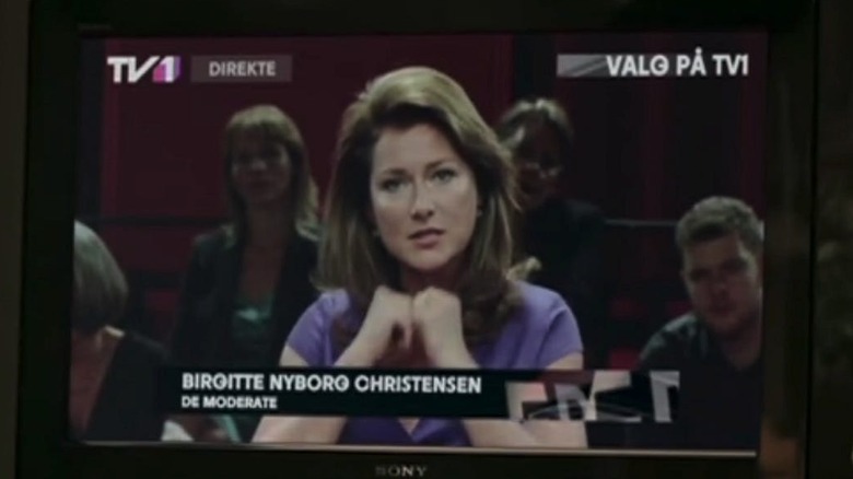 Sidse Babett Knudsen as Birgitte Nyborg Christensen speaking on Danish TV in Borgen