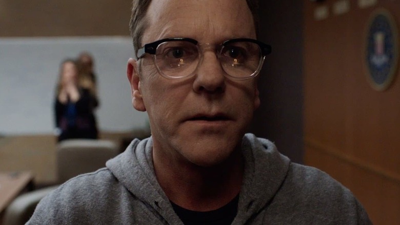 Kiefer Sutherland as Tom Kirman wearing a hoodie and looking terrified in Designated Survivor