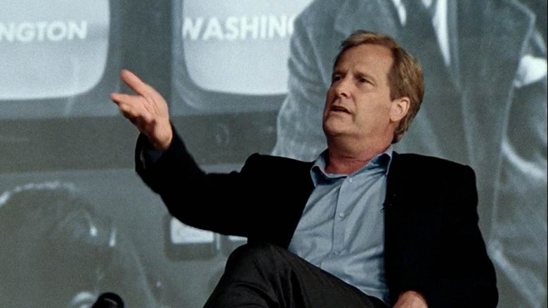 Jeff Daniels as Will McAvoy holding his hand out in The Newsroom