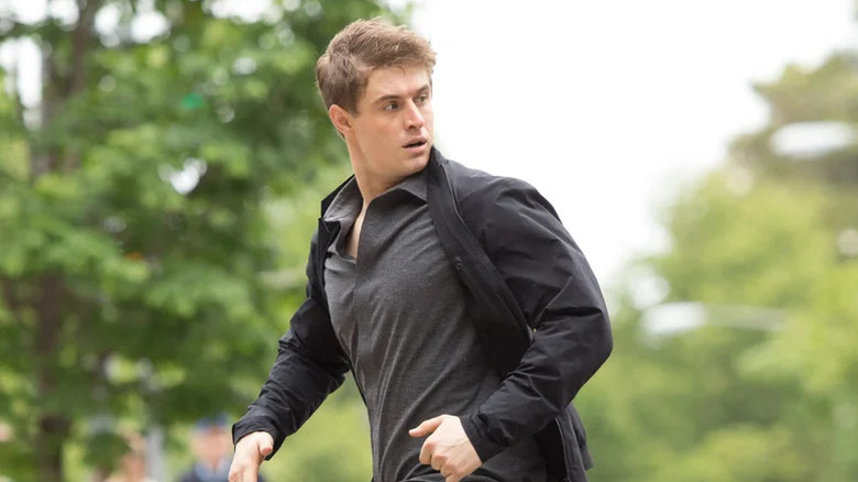 Max Irons as Joe looking behind him in Condor