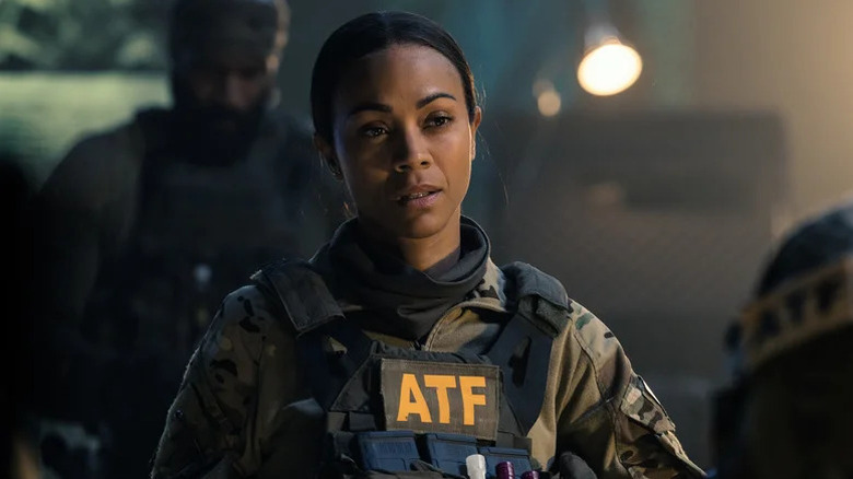 Zoe Saldaña as Joe wearing army greens and ATF vest in Lioness