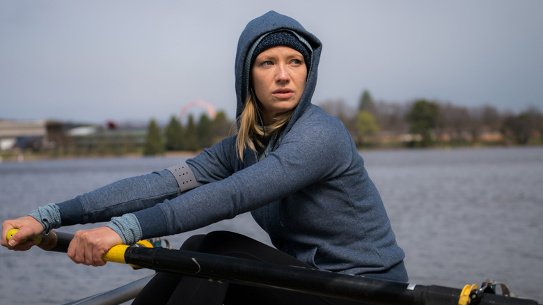 Anna Torv as Harriet rowing a boat in Secret City