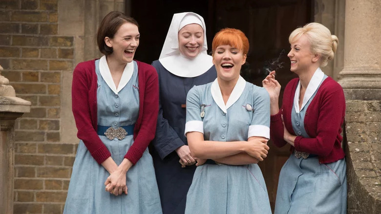 Barbara Gilbert, Sister Winifred, Patsy Mount, and Trixie Franklin laughing outside