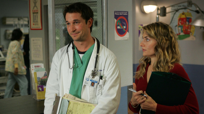 John Carter and Wendall Meade standing together in hospital