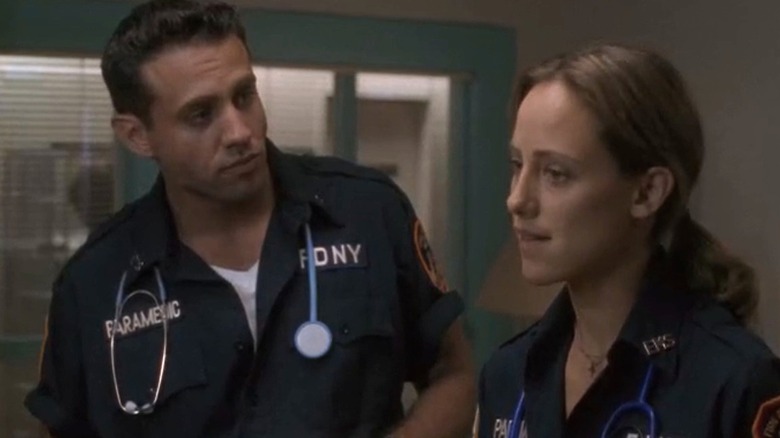 Bobby and Kim wearing blue paramedic uniforms