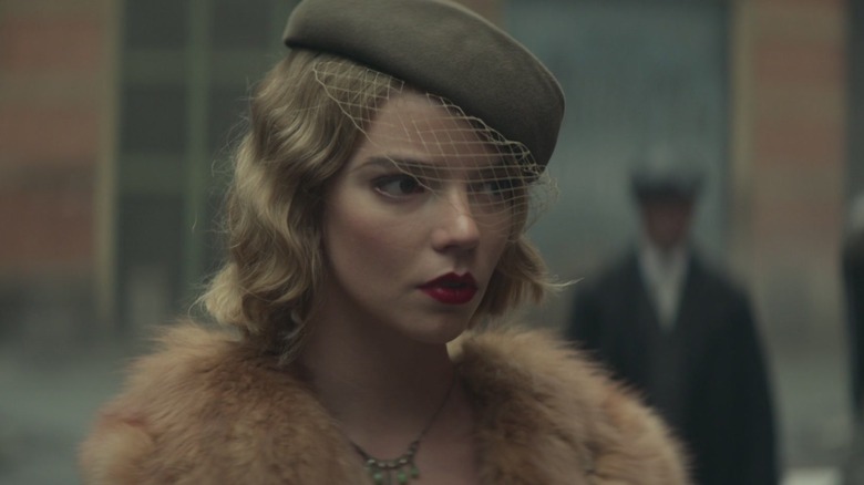 Anya Taylor-Joy as Gina Gray wearing a veil outside in "Peaky Blinders."