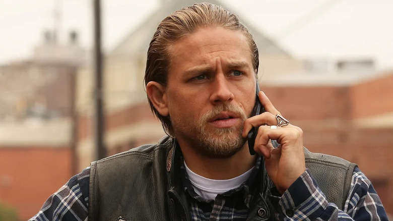 Charlie Hunnam as Jax Teller, taking a phone call in Sons of Anarchy.