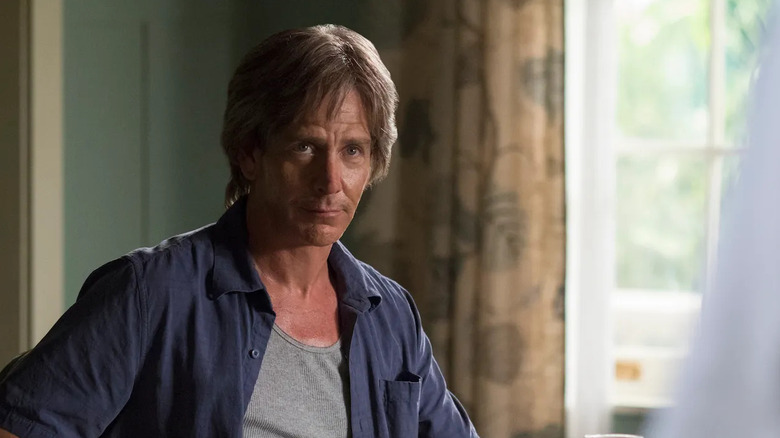 Ben Mendelsohn as Danny Rayburn, sitting at a table in Bloodline.
