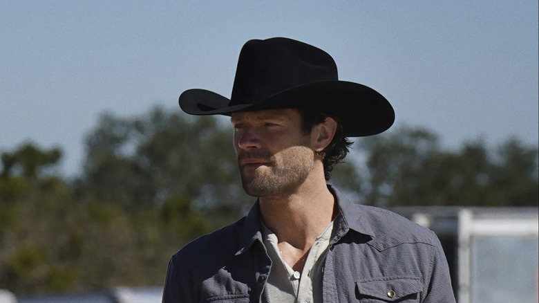 Cordell Walker (Jared Padalecki) stands cautiously while wearing a large cowboy hat in Walker