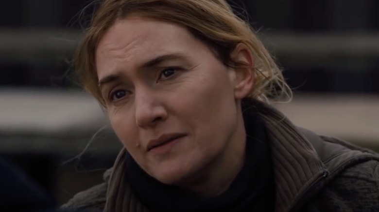Kate Winslet as Mare Sheehan looking sad in Mare of Easttown