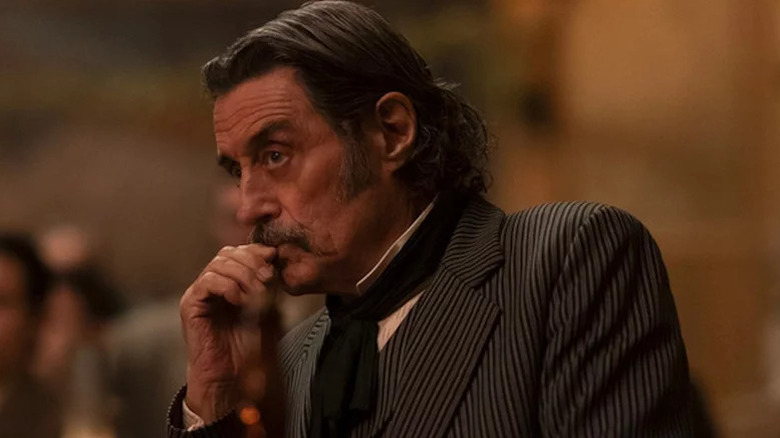 Ian McShane as Al Swearengen in striped in suit in Deadwood