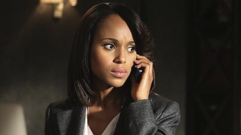 Kerry Washington as Olivia Pope wearing grey suit and holding phone to her ear in Scandal