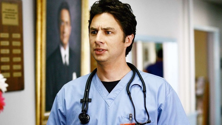 Zach Braff as J.D. in blue scrubs with stethoscope looking confused in Scrubs