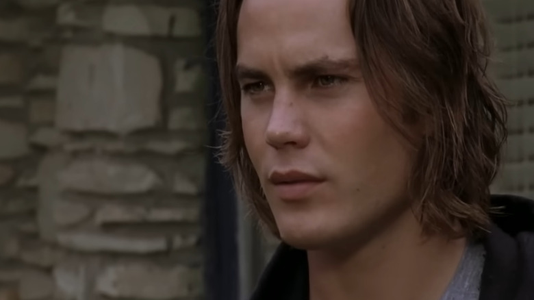 Tim Riggins (Taylor Kitsch) looking serious in Friday Night Lights