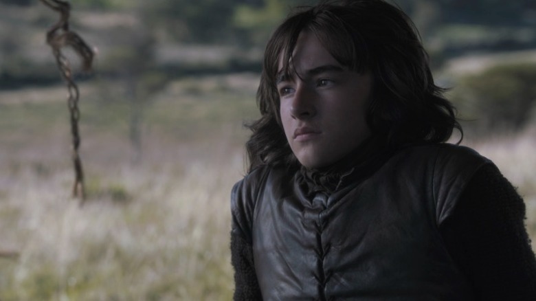 Bran sitting on the ground and staring off into the distance on Game of Thrones S3E2