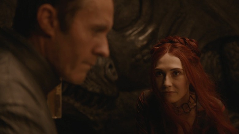 Melisandre staring intently at Stannis on Game of Thrones S2E2