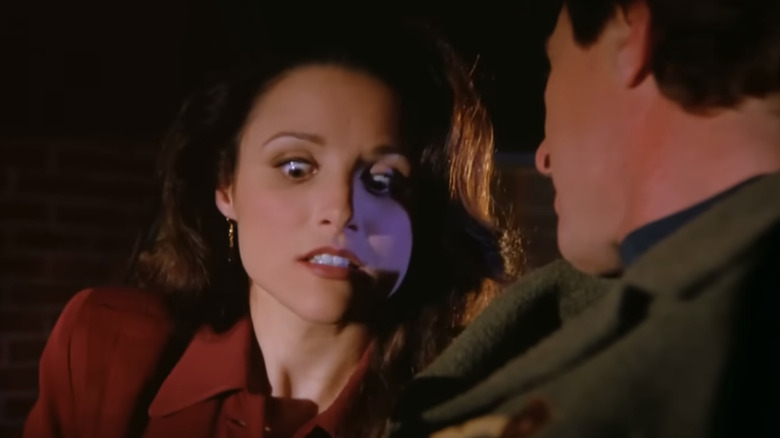 Julia Louis-Dreyfus as Elaine looking down in horror in Seinfeld.