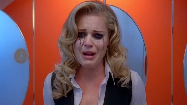 Alexis Meade (Rebecca Romijn) cries with makeup running down her face in Ugly Betty