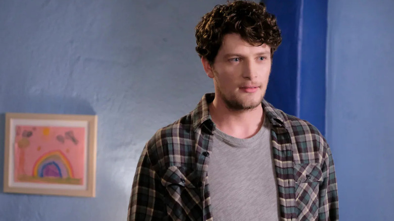 Michael Cordero (Brett Dier) stands expectantly in Jane the Virgin