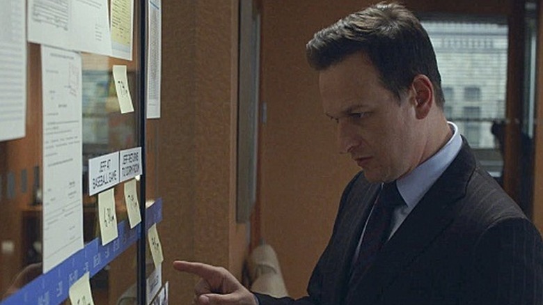 Will Gardner (Josh Charles) examines an evidence board in The Good Wife