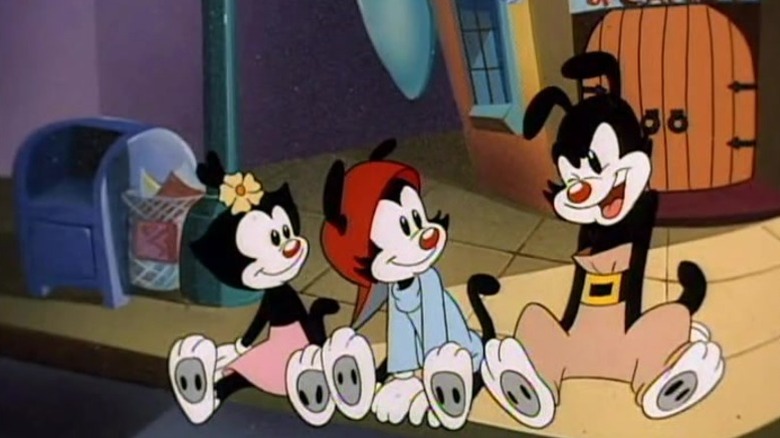 Dot and Wakko sitting on a sidewalk and watching Yakko speak on Animaniacs S1E8