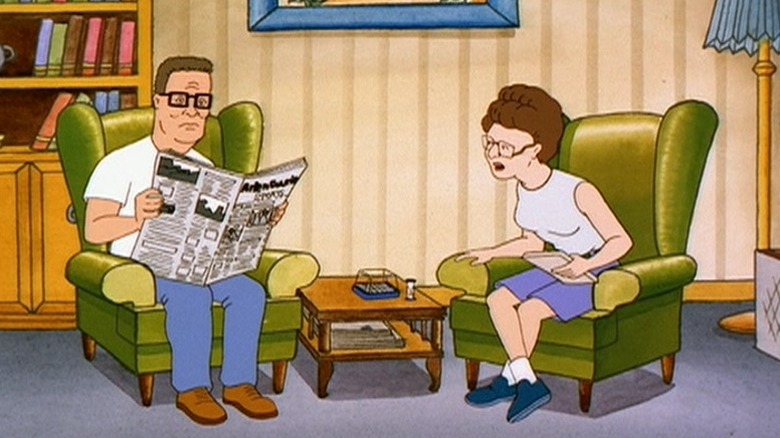 Hank reading the newspaper in an armchair while Peggy speaks to him from the other armchair on King of the Hill S1E6