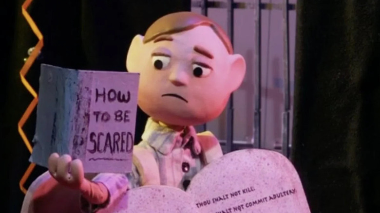 Orel reading a book on "Moral Orel."
