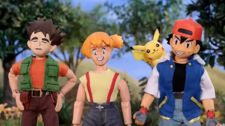 Brock, Misty, Pikachu, and Ash standing together and smiling on "Robot Chicken."