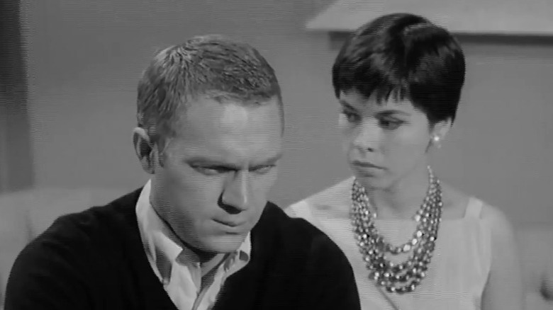 The gambler and the woman sitting with grave expressions on Alfred Hitchcock Presents S5E15
