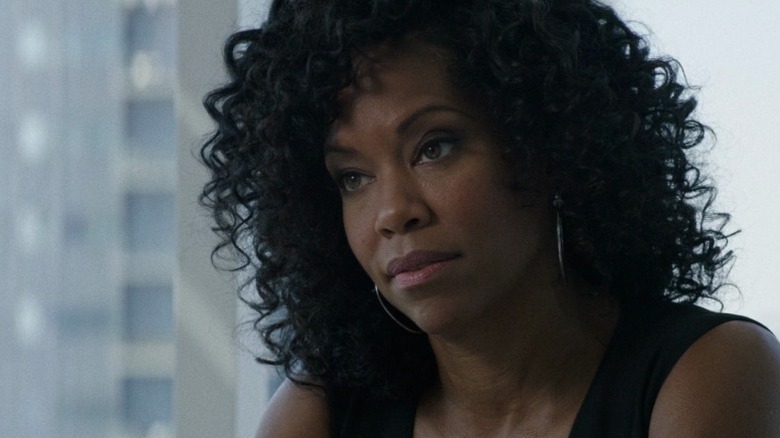 Terri sitting in her office with a skeptical expression on American Crime S2E7