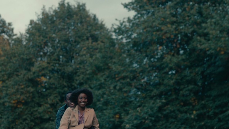 Franklyn and Martha riding a bicycle together on Small Axe S1E2