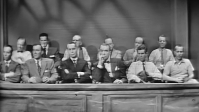 The twelve members of the jury sitting in the jury box on Studio One S7E1