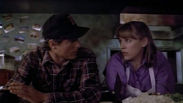 Fred and Erma sitting side by side at the counter on Tales from the Crypt S4E6