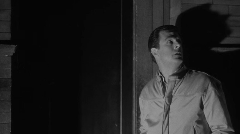 Trent standing next to a doorway and looking up on The Outer Limits S2E5