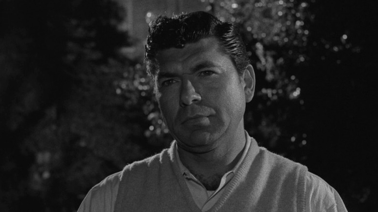Steve standing and frowning on The Twilight Zone S1E22