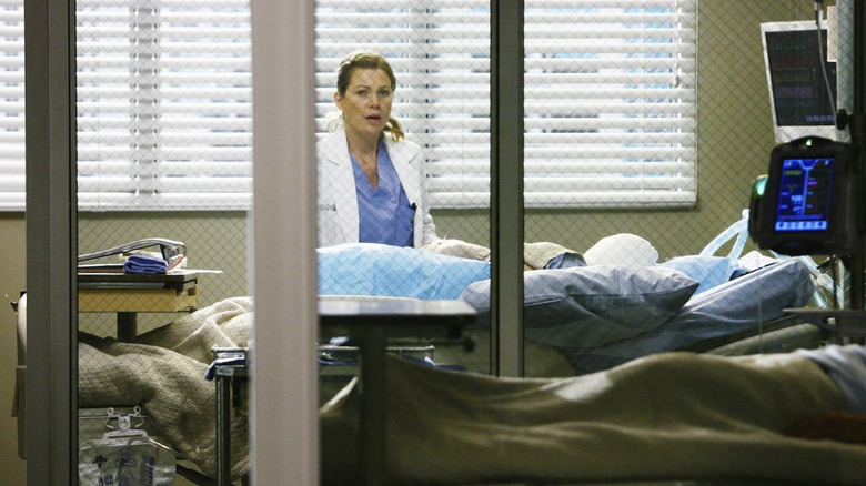 Meredith (Ellen Pompeo) in George's (T.R. Knight) hospital room looking horrified on Grey's Anatomy