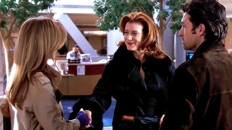 Addison (Kate Walsh) introducing herself to Meredith (Ellen Pompeo) in front of Derek (Patrick Dempsey) on Grey's Anatomy