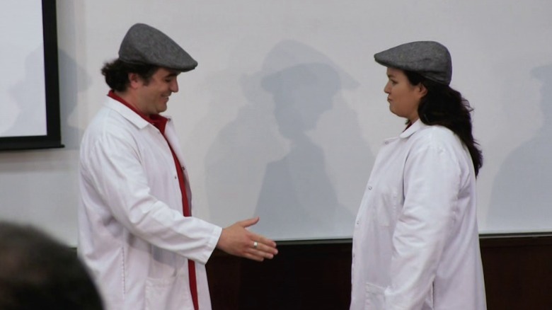 Q and Rosie O'Donnell standing face to face in identical clothes on Impractical Jokers S2E22