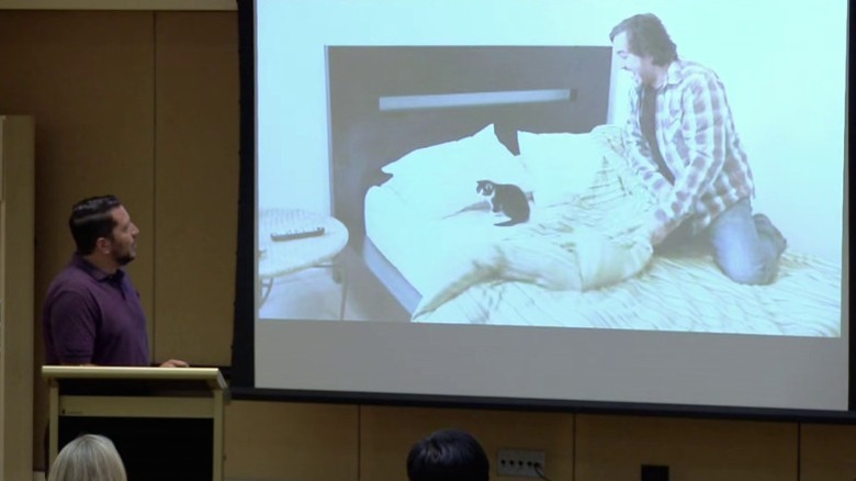 Sal watching a video of Q uncovering a cat sitting on his bed on Impractical Jokers S2E18