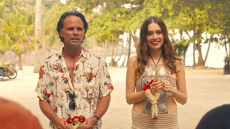 Rick and Chelsea stand on a beach in The White Lotus Season 3