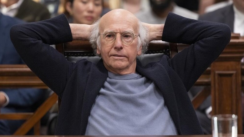 Larry David leaning back in a courtroom in Curb Your Enthusiasm