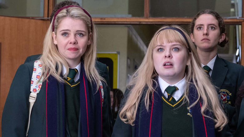 Erin,  Clare, and Orla looking scared in Derry Girls