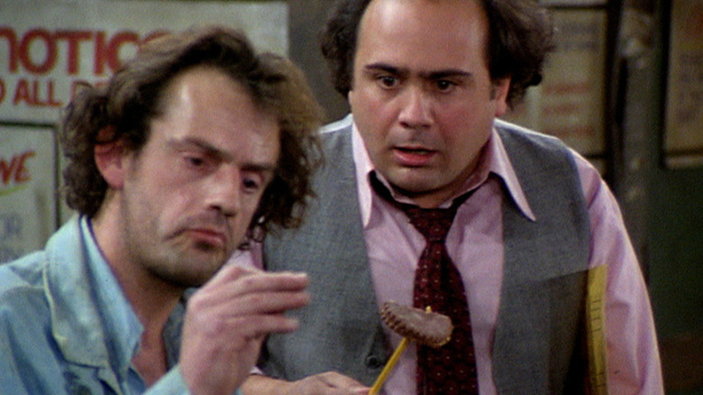 Jim and Louie looking at cookies in Taxi