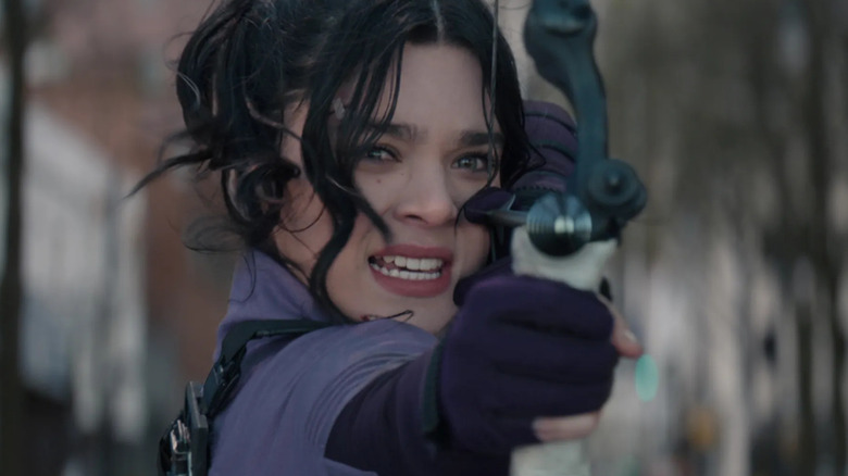 Hailee Steinfeld as Kate Bishop aiming an arrow in Hawkeye