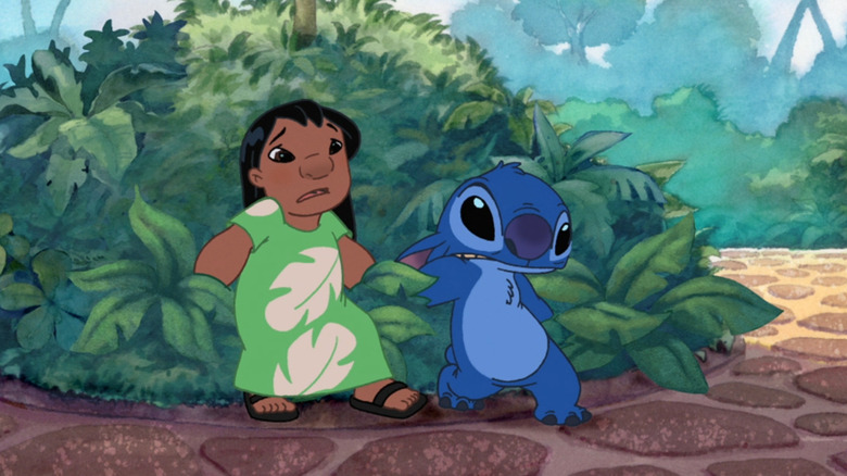 Lilo and Stitch holding hands in a bush looking scared in Lilo & Stitch: The Series