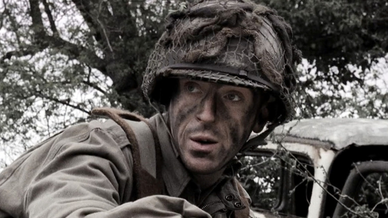 Richard D. Winters with black face paint and a helmet on
