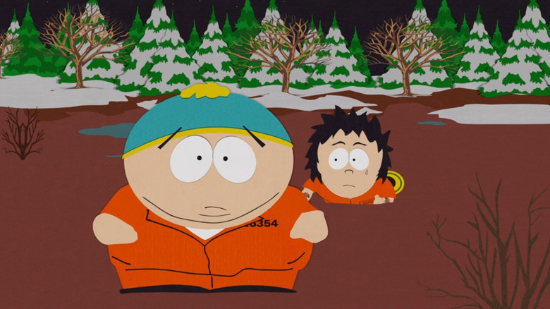 Cartman in a prison jumpsuit in the woods in "South Park" (1997)