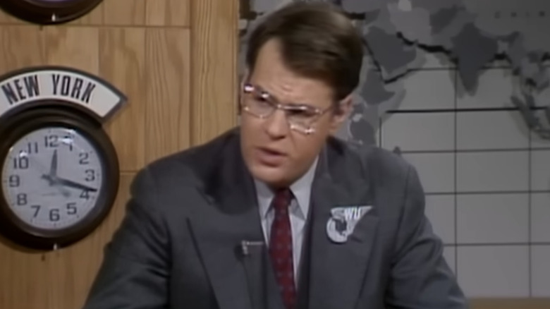Dan Aykroyd looking upset during Weekend Update on SNL