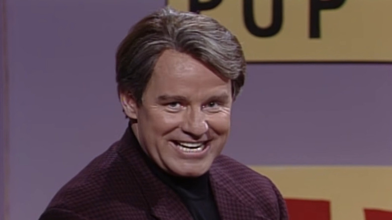 Phil Hartman smiling at the camera on SNL